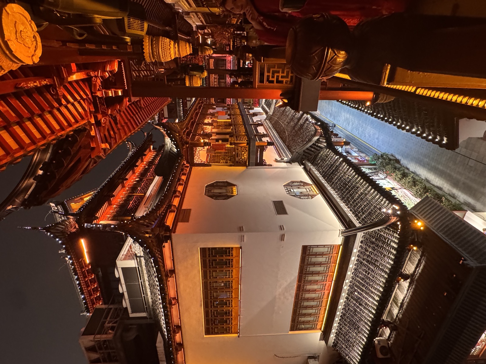 Lantern-lit rooftops and lanes of an old Chinese city at night